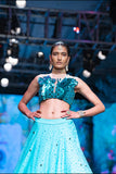 THE DAWN LEHENGA AND METALIC FEATHER SEQUENCE CROP TOP SET IN TEAL BLUE