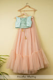 SALMON PINK TIERED LEHENGA WITH BLUE EMBOIDERED CROPTOP