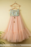 SALMON PINK TIERED LEHENGA WITH BLUE EMBOIDERED CROPTOP